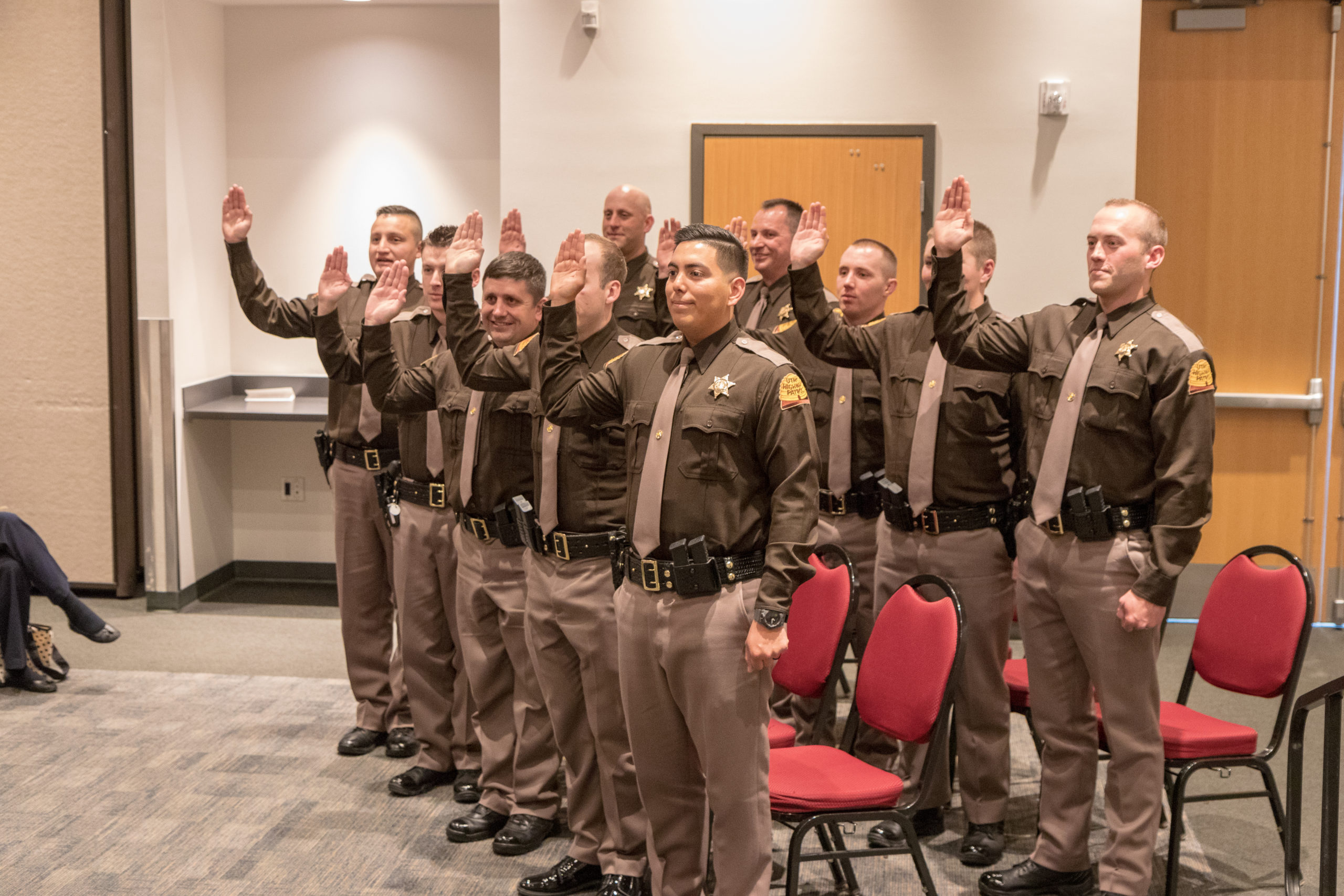 Trooper in front of cruiser and helicopter